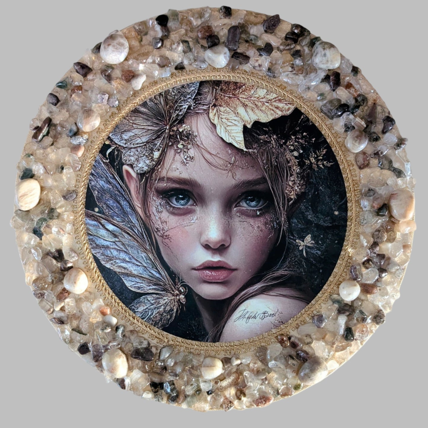 "Enchanting handmade canvas featuring a pixie print and natural stones, capturing nature's magic and mystical charm."