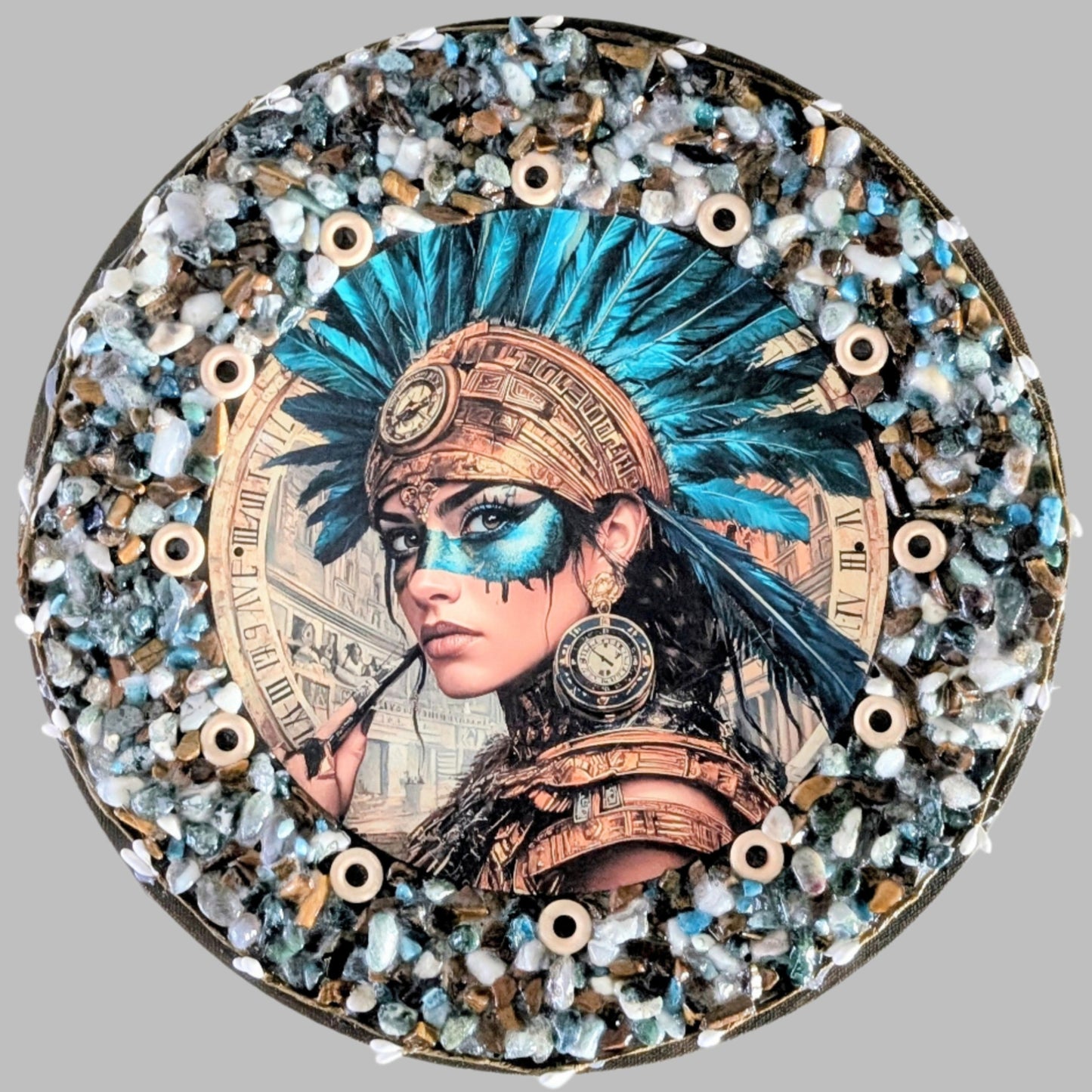 "Native strength and heritage captured in a handmade canvas with blue and bronze stones, symbolising wisdom and resilience."