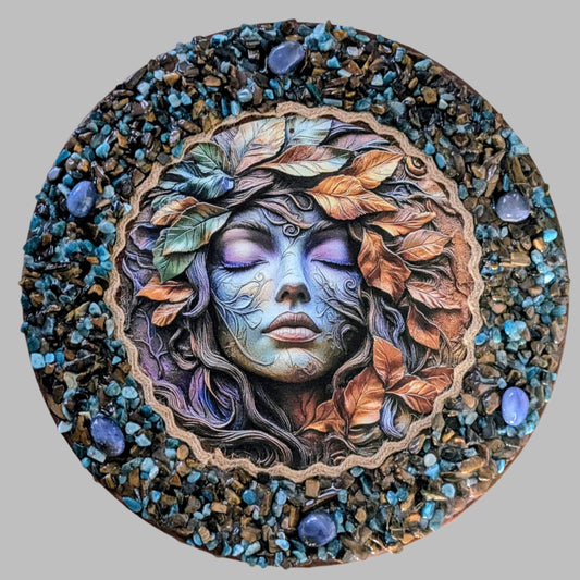 "Autumn magic captured in a handmade canvas with earthy stones, golden leaves, and a print of mystical woodland scene."
