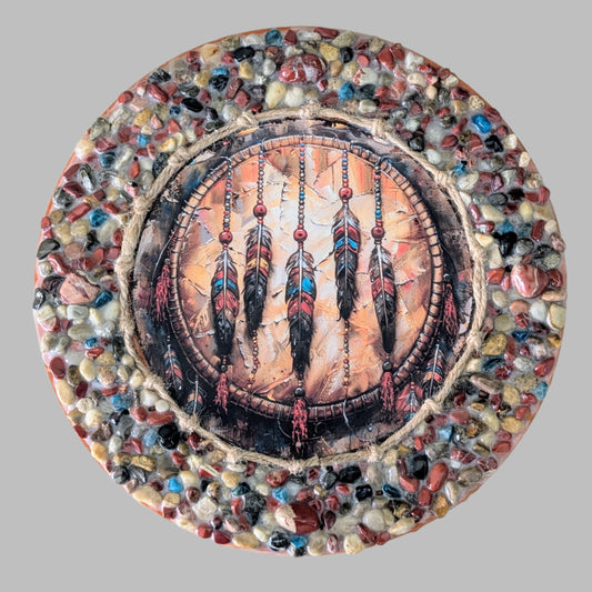 "Feathers in the Sky" is a handmade canvas with a intricate feathers print, earthy stones, and vibrant aqua accents, symbolising wisdom and freedom.